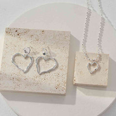 BOLD ASYMMETRICAL HEART EARRINGS